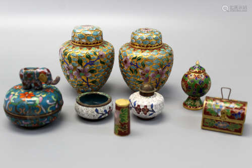 A group of Chinese cloisonne boxes and jars.