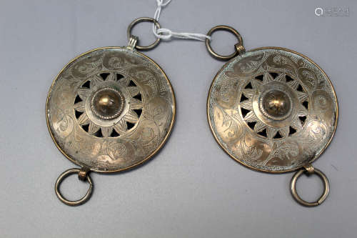 A pair of antique Chinese minority ethnic group metal ear rings