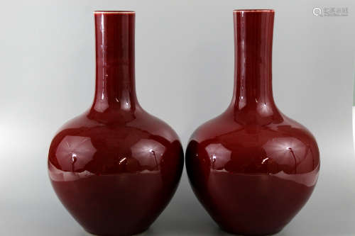 A pair of Chinese ox blood porcelain vases.