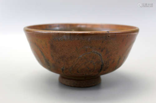 A brown glazed bowl