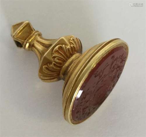 A small gold Antique seal with oval crested cornel