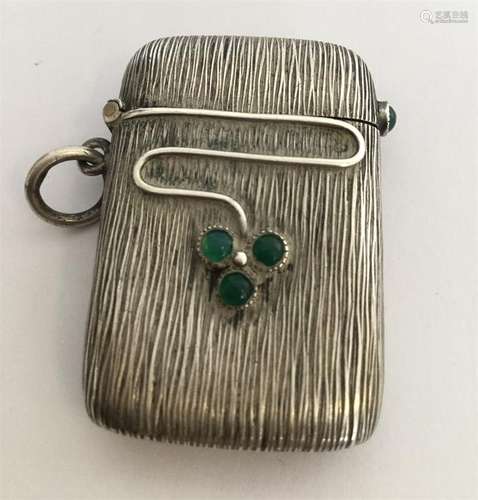 A stylish silver vesta with vine decoration. Appro