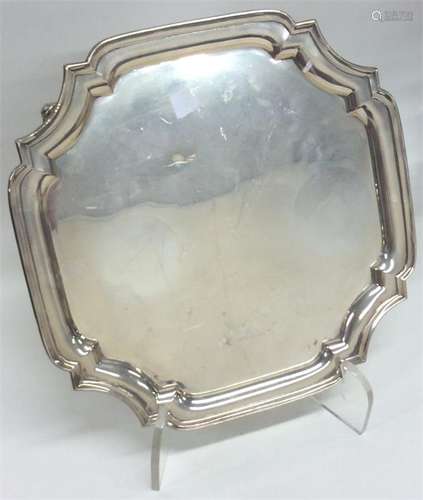 A small square silver salver with cut corners. Bir