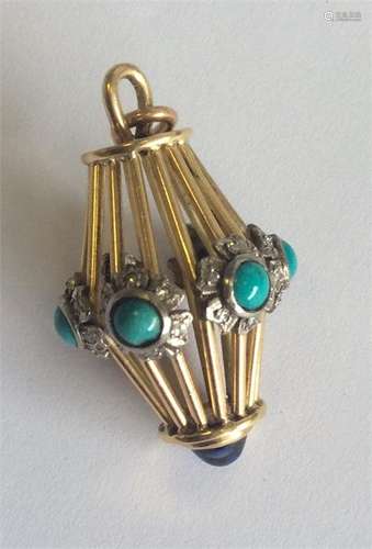 A heavy turquoise and diamond pendant with cabocho