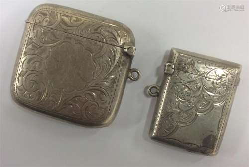 A good silver scroll decorated vesta with hinged t