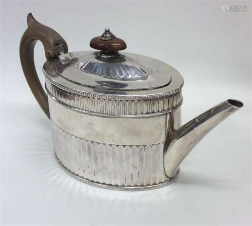 A good Georgian silver teapot with half fluted bod