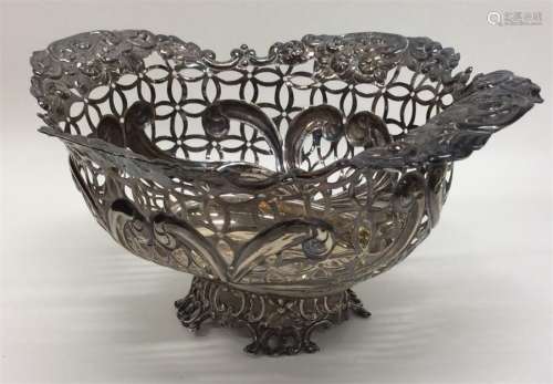 An attractive pierced sweet dish embossed with flo