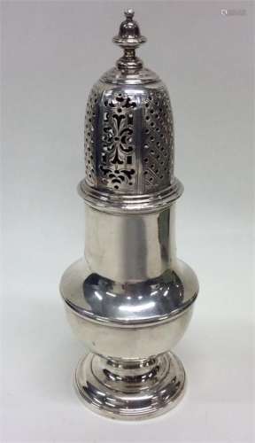 A good large Georgian silver sugar caster with pie