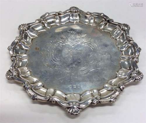 A small pie-crust salver with shell decoration. Bi