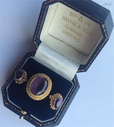 An 18 carat amethyst weave-decorated ring together