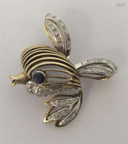 A 14 carat modernistic brooch inset with numerous