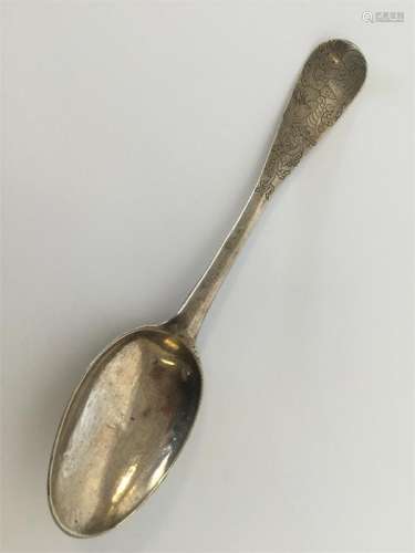 An attractive silver tablespoon decorated with flo