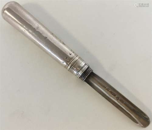 A Georgian tapering silver apple corer of typical