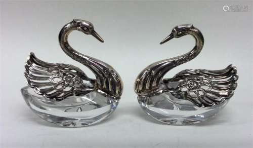 A pair of unusual glass-mounted and silver salts i