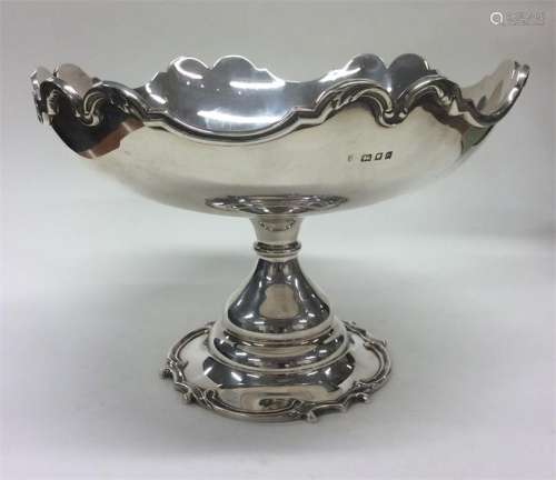 A heavy good quality silver sweet dish with wavy e