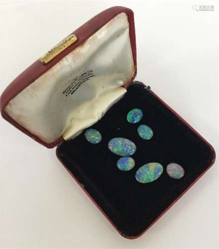 A group of unmounted black opal doublets. Approx.