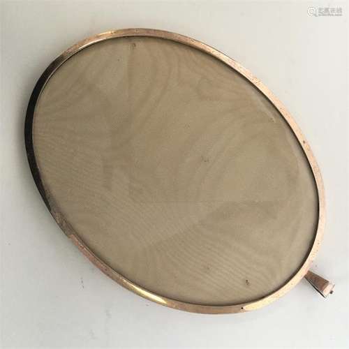 A large silver gilt oval picture frame with loop t