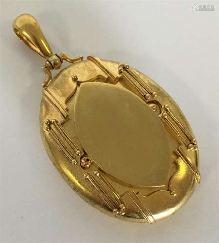 A good quality Victorian 15 carat oval locket with