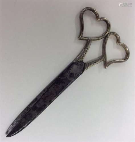 A good pair of silver mounted scissors with heart