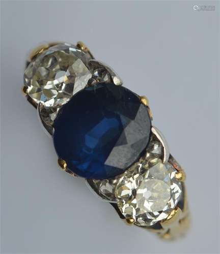 An 18 carat sapphire and diamond three stone ring