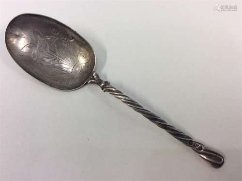 A Russian spoon, the bowl decorated with flowers a