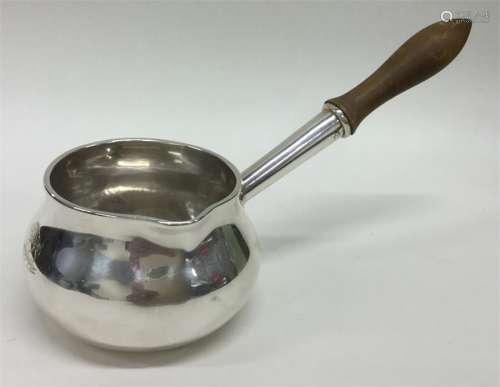 A good quality Georgian silver brandy pan with tur