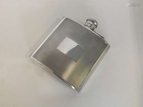 A good quality silver hip flask with hinged top. B