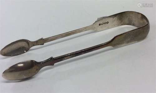 EXETER: A pair of fiddle pattern sugar tongs.Est.