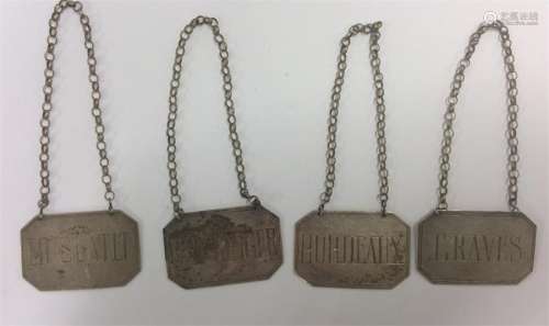 A set of four stylish silver wine labels with cut