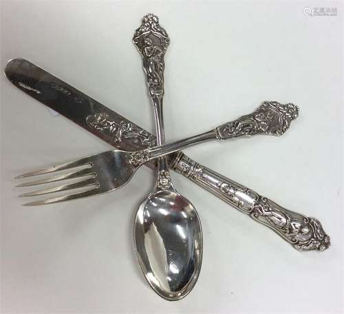 A good silver three piece christening set profusel