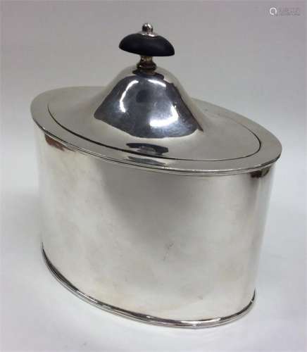 A Georgian oval silver tea caddy with hinged top.