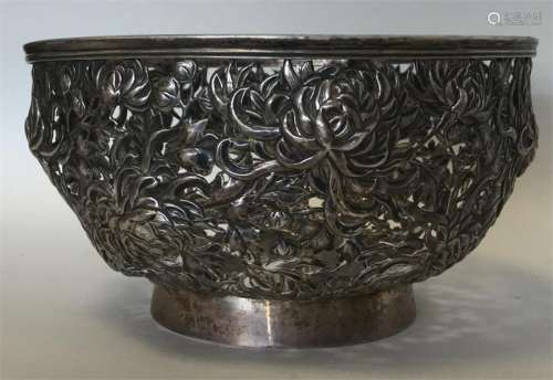 A good Chinese silver bowl decorated with flowers