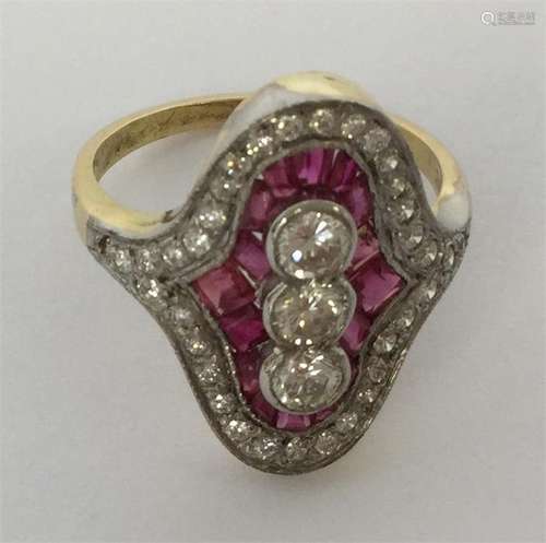 An attractive ruby and diamond cluster ring set wi