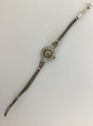 A heavy lady's diamond cocktail watch on gold mesh