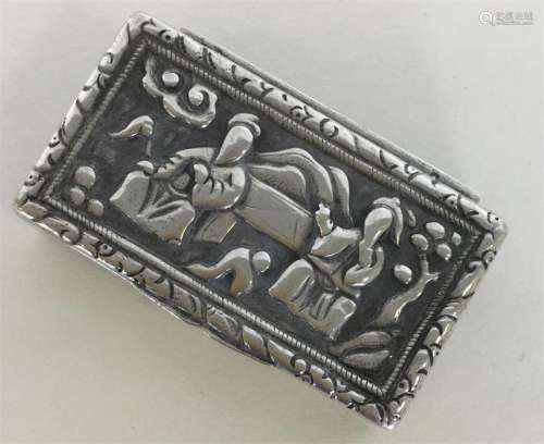 A Chinese silver hinged top box embossed with figu