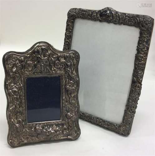 Two silver embossed picture frames. Est. £20 - £30