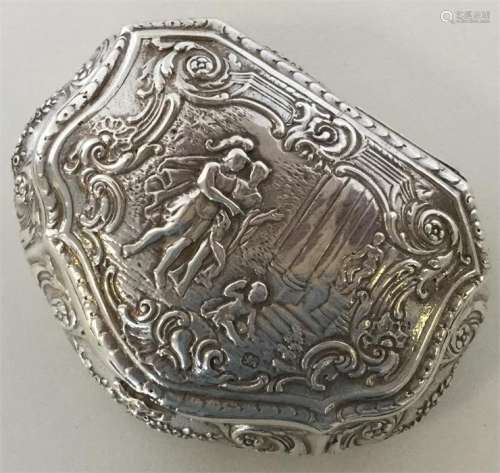 A 19th Century French silver snuff box heavily dec
