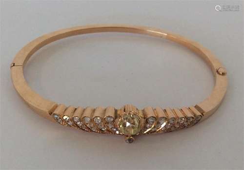 A heavy high carat gold bangle with numerous rows