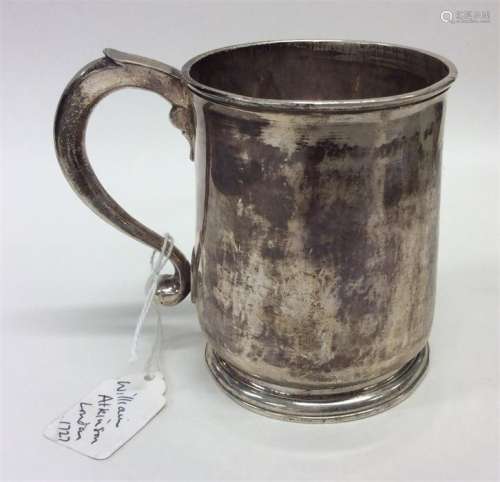A George II tapering silver mug of typical design.