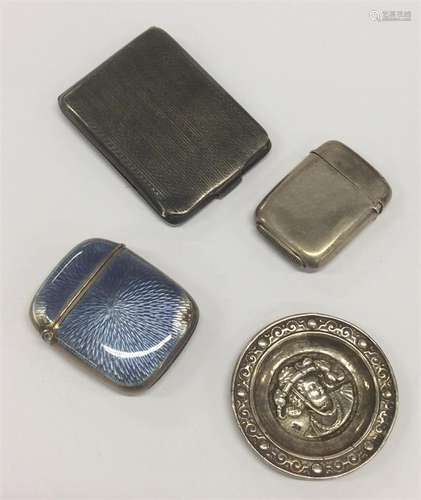 A silver engine turned match case together with a