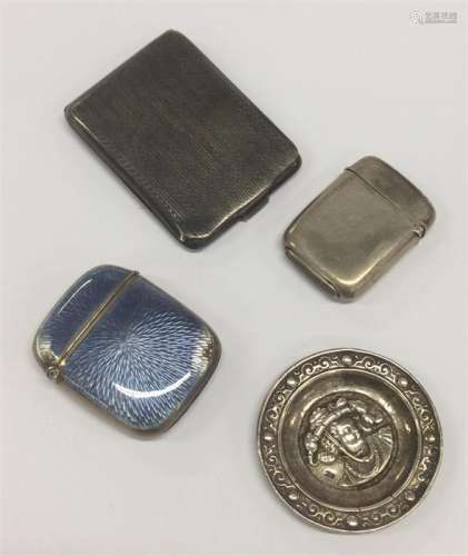 A silver engine turned match case together with a