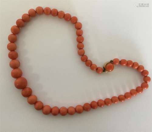 A good graduated string of coral beads with gold c