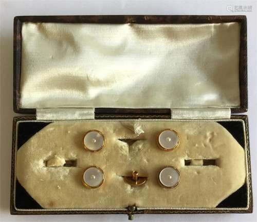 A group of four MOP and gold buttons with pearl mo