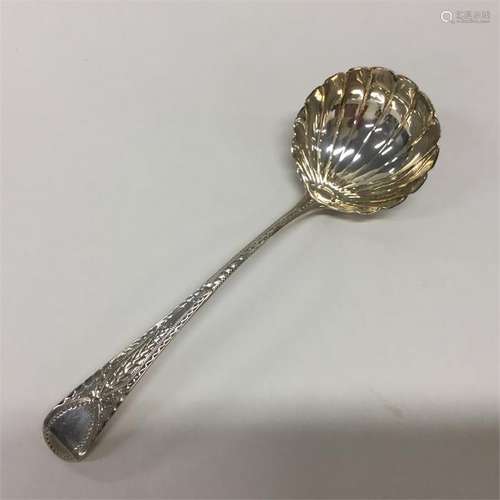 A Georgian silver sauce ladle with shell bowl and