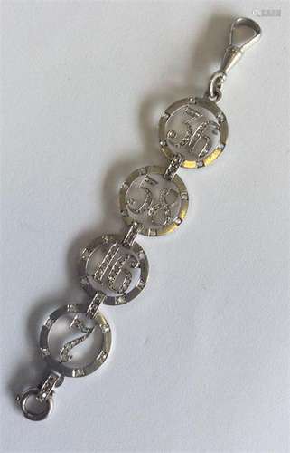 A French platinum and diamond pendant of circular