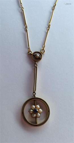 A pearl and sapphire pendant in 15 carat on chain.