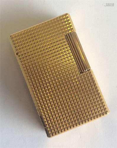 A Dupont of Paris gilt lighter with engine turned