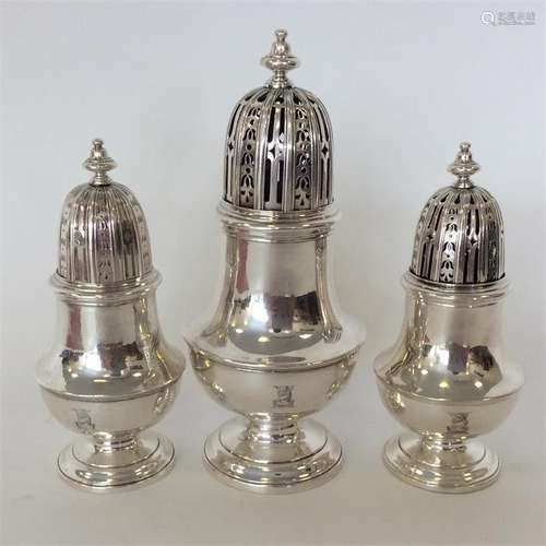 A rare set of three silver George I casters, each