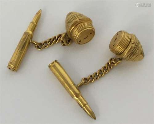 A pair of unusual gold cufflinks in the form of bu