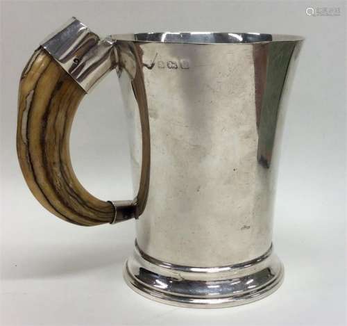 A good silver tapering mug with horn handle. Birmi